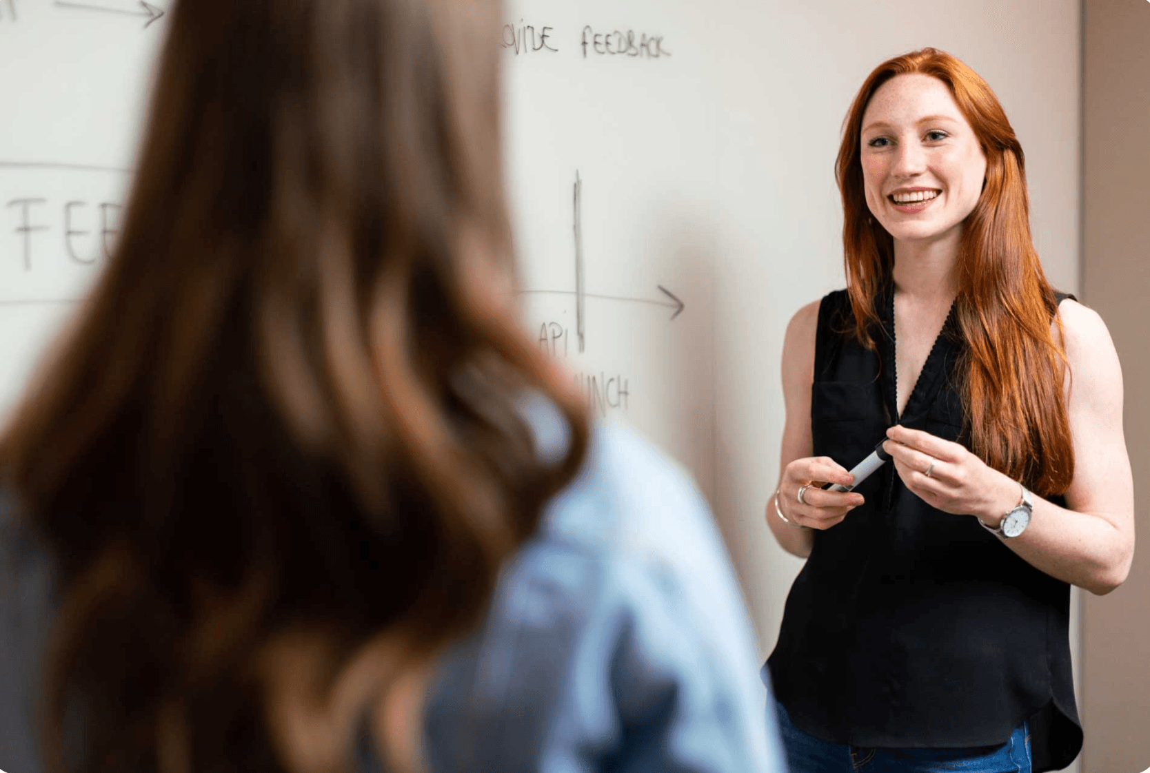 Diverse group of students engaged in interactive learning, embodying our core values of equity, empathy, and community